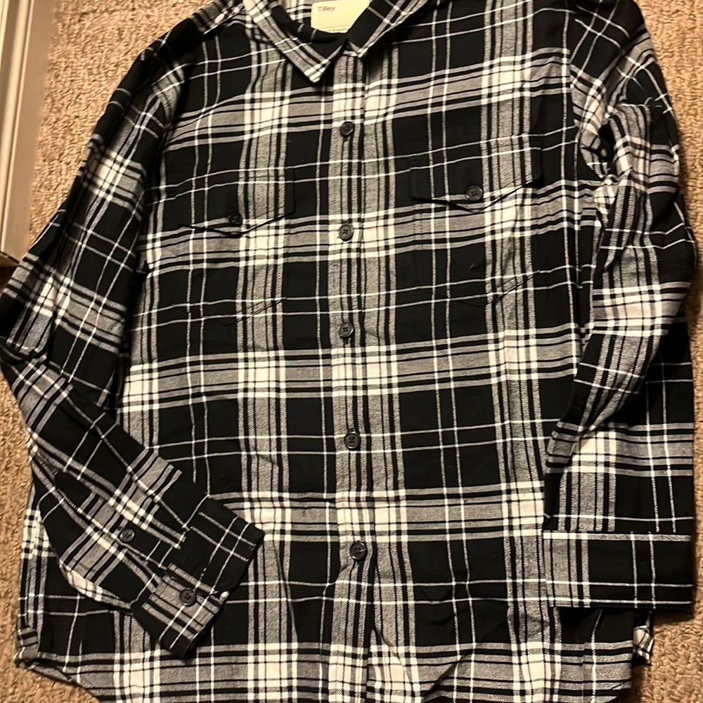 Black and white plaid. Very soft. Brand new never worn.